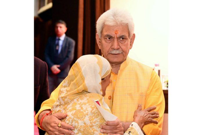 LG Manoj Sinha meets a family member of terror victim in Srinagar on Thursday.