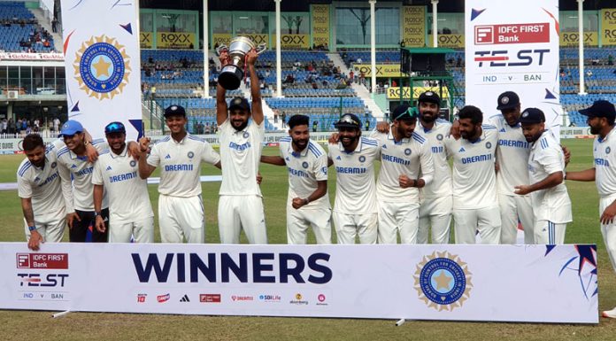 Indian cricket team players pose for photographers with the trophy after winning the second test cricket match against Bangladesh at Green Park Stadium in Kanpur on Tuesday. (UNI) Indian cricket team players pose for photographers with the trophy after winning the second test cricket match against Bangladesh at Green Park Stadium in Kanpur on Tuesday. (UNI)