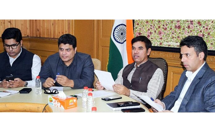 Div Com Kashmir Vijay Kumar Bidhuri chairing a meeting.