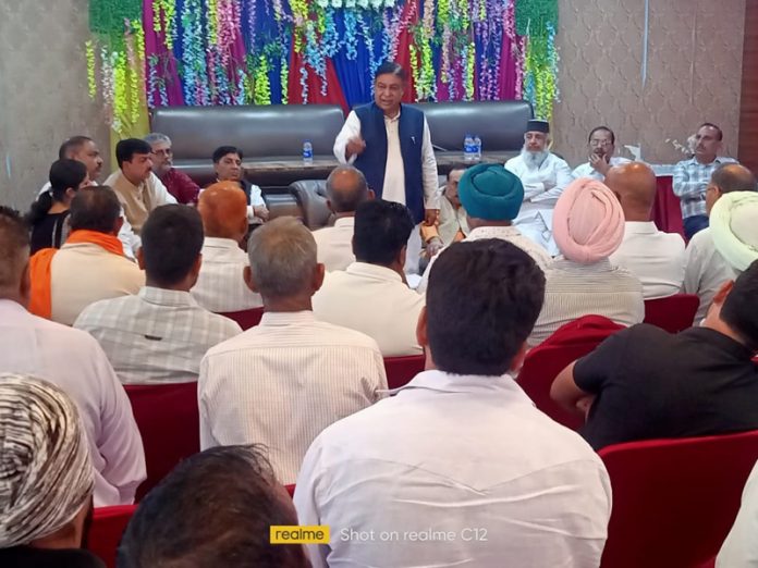 Congress leader Ravinder Sharma interacting with party leaders in Samba on Monday. Congress leader Ravinder Sharma interacting with party leaders in Samba on Monday.
