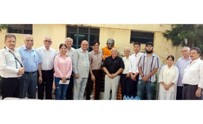 Dignitaries posing along with differently abled students.