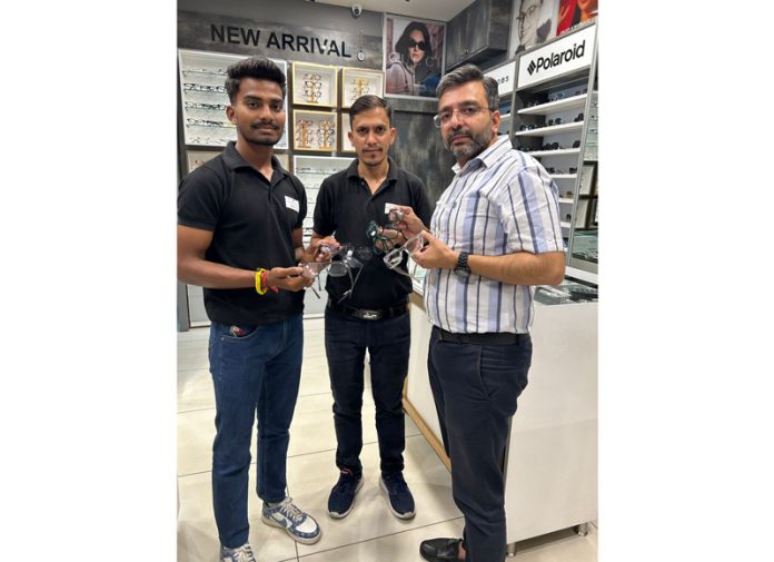 A dignitary at Chashma Junction Goel Opticians showing eyeglasses. A dignitary at Chashma Junction Goel Opticians showing eyeglasses.