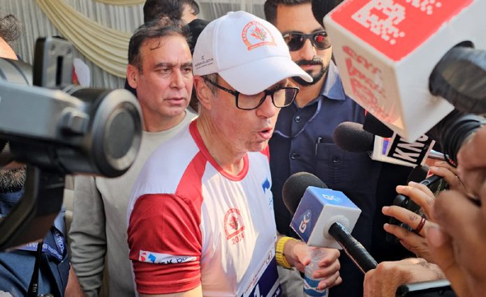 Chief Minister Omar Abdullah speaking with media persons after running half marathon in Srinagar on Sunday. - Excelsior/Shakeel Chief Minister Omar Abdullah speaking with media persons after running half marathon in Srinagar on Sunday. - Excelsior/Shakeel