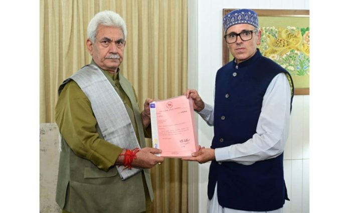 NC president Omar Abdullah handing over letter of support to LG Manoj Sinha in Srinagar on Friday. —Excelsior/Shakeel NC president Omar Abdullah handing over letter of support to LG Manoj Sinha in Srinagar on Friday. —Excelsior/Shakeel
