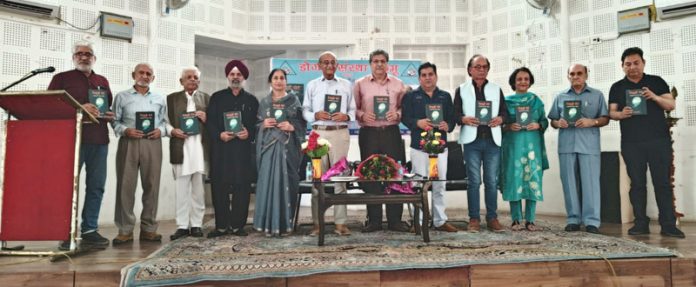 Prominent litterateurs and Dogri Sanstha members releasing Prof Lalit Magotra's book. Prominent litterateurs and Dogri Sanstha members releasing Prof Lalit Magotra's book.