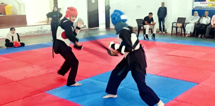 Girls in action during Inter District UT Level Thang-Ta Championship at Ganderbal. Girls in action during Inter District UT Level Thang-Ta Championship at Ganderbal.