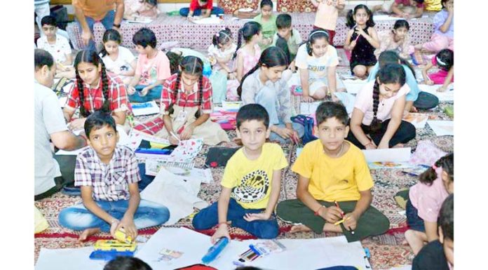 Young artists displaying their skills during painting competition.