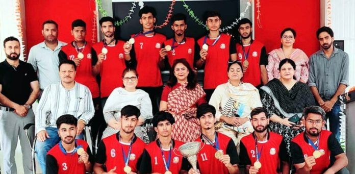 Volleyball players of GDC Kunjwani posing along with college management.