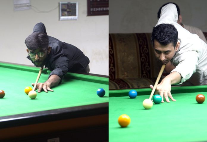 Sunny Rajput and Adnan Lone in action during Snooker match at MA Stadium, Jammu on Wednesday. — Excelsior/Rakesh Sunny Rajput and Adnan Lone in action during Snooker match at MA Stadium, Jammu on Wednesday. — Excelsior/Rakesh
