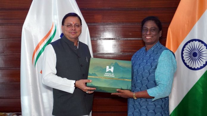 Uttarakhand Chief Minister Pushkar Singh Dhami posing along with IOA president PT Usha. Uttarakhand Chief Minister Pushkar Singh Dhami posing along with IOA president PT Usha.
