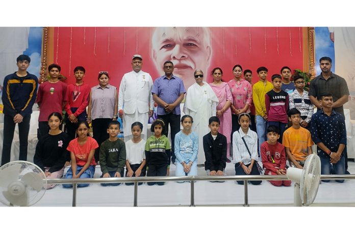 B K Sudarshan Didi, Patron-in-Chief of Yoga Association J&K posing along with team members and dignitaries.