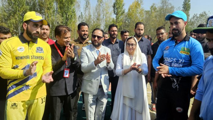 Dr. Syed Darakhshan Andrabi, Chairperson J&K Waqf Board posing along with two captains during opening ceremony of a tournament at Pulwama. Dr. Syed Darakhshan Andrabi, Chairperson J&K Waqf Board posing along with two captains during opening ceremony of a tournament at Pulwama.