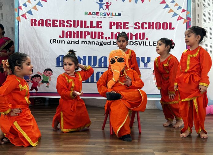 Toddlers presenting cultural item during Annual Day event.