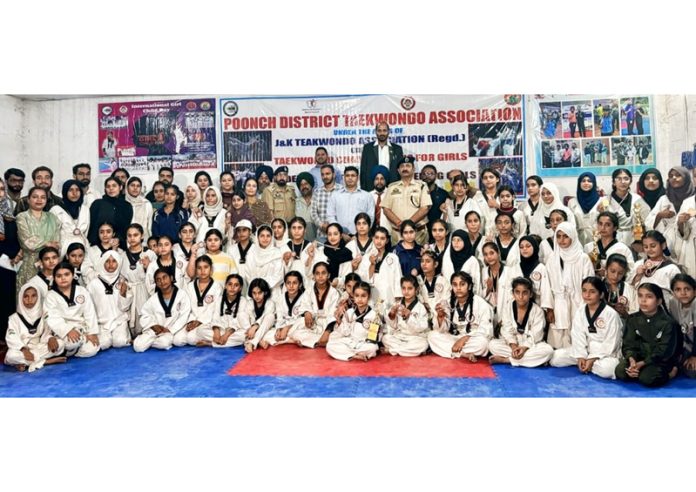 Taekwondo players posing for group photograph along with dignitaries during closing ceremony at Poonch.
