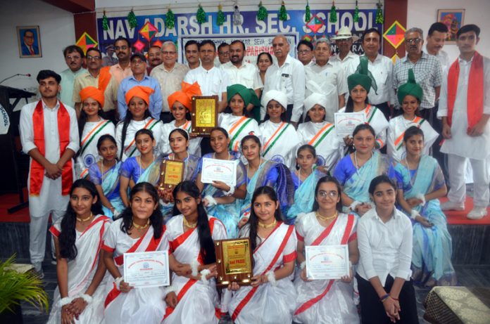 Students along with others posing for a group photograph during a programme organised by BVP in Kathua on Wednesday.