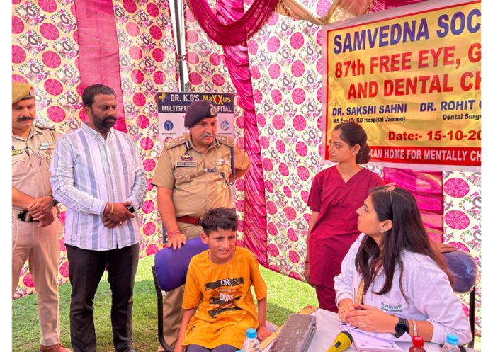 DIG JSK Range Shiv Kumar Sharma interacting with a doctor during a health check up camp in Jammu. DIG JSK Range Shiv Kumar Sharma interacting with a doctor during a health check up camp in Jammu.