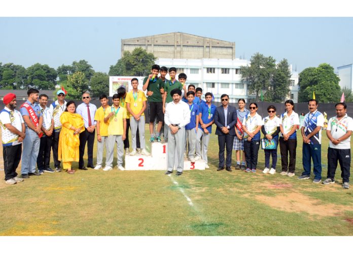 Winners on podium posing with medals. Winners on podium posing with medals.