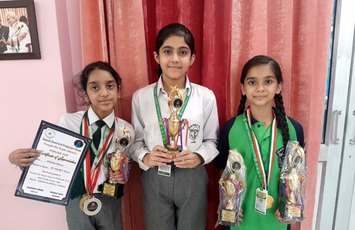 DPS Jammu students display medals and trophies they won at a national level Dance Championship. DPS Jammu students display medals and trophies they won at a national level Dance Championship.