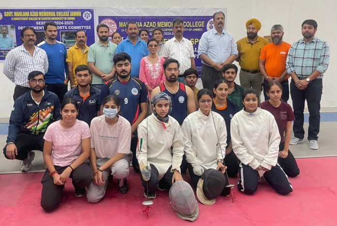 Fencers posing along with dignitaries during an event at Cluster University of Jammu.