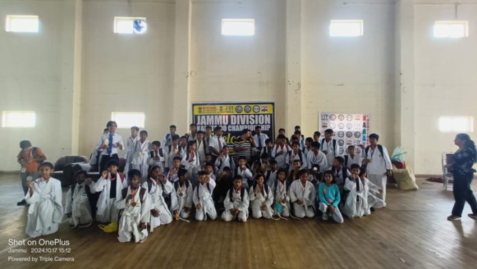 Karate players posing for group photograph.