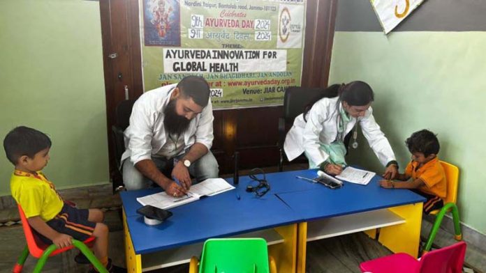 Doctors examining children at free health camp. Doctors examining children at free health camp.