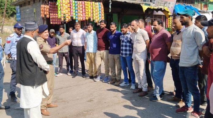 Traffic police officers during awareness programme in Rajouri.