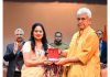LG felicitating a writer on Thursday.
