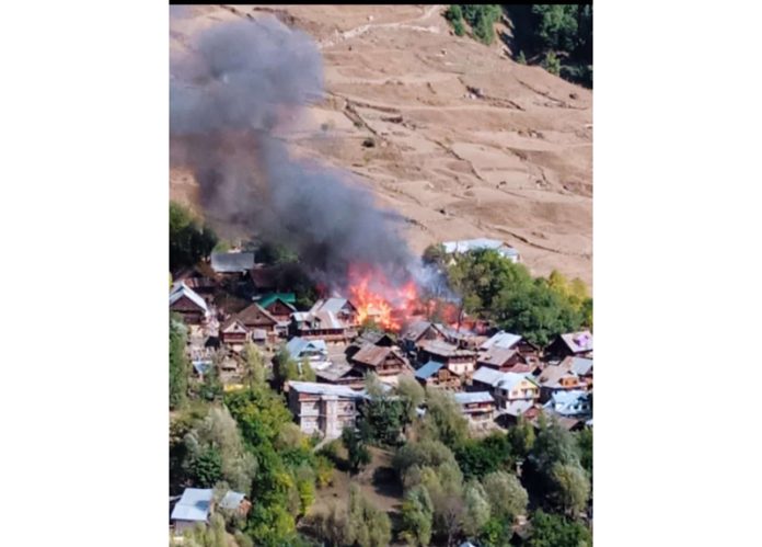 Houses on fire at Mulwarwan in Kishtwar on Monday. — Excelsior/Tilak Raj