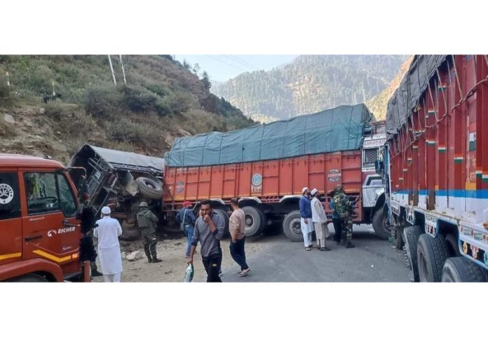 Collision between two fruit laden trucks block Jammu-Srinagar Highway at Ramban on Tuesday. —Excelsior/Parvez Mir