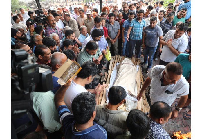 People gathered at Shakti Nagar Cremation Ground in Jammu to pay final respect to terror attack victim Shashi Abrol. —Excelsior/Rakesh