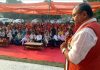 MLA Bahu, Ch. Vikram Randhawa addressing a public meeting at Raipur Satwari on Sunday.
