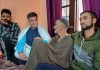 BJP President Ravinder Raina along with Seh Prabhari Rafiq Ah Wani meeting the family of Kaisar Ahmad of Qangam Shangus Anantnag. — Excelsior/Sajad Dar
