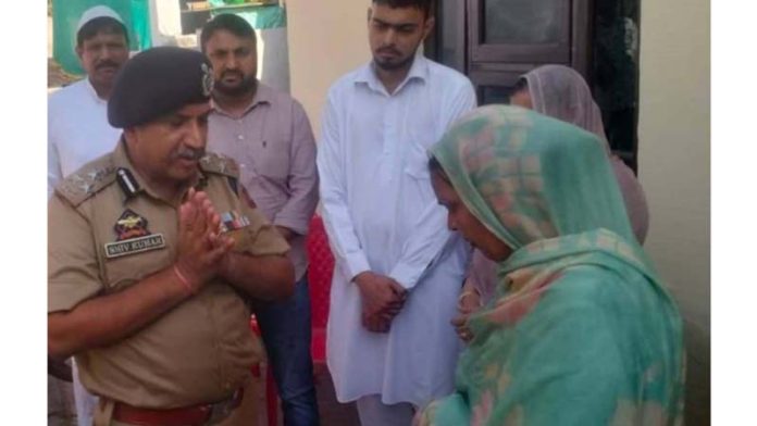 DIG JSK Range, Shiv Kumar Sharma meeting family of martyr HC Bashir Ahmed at Channi Himmat area on Thursday.
