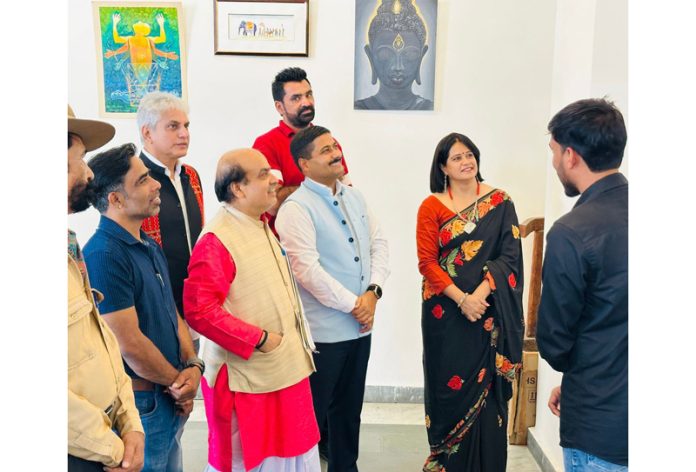 People visiting art exhibition in Jammu on Tuesday.