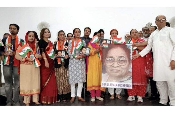 Dignitaries posing for a group photograph after paying tribute to Gandhian leader Nirmala Deshpande at Jammu on Thursday.
