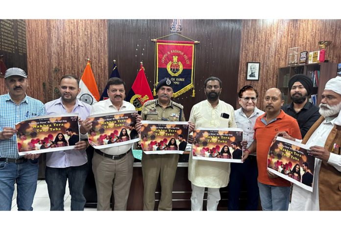 DIG, Shiv Kumar Sharma along with others releasing poster of a Dogri song at Jammu on Thursday.