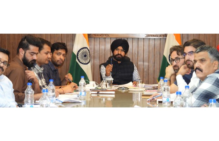 DDC Harvinder Singh chairing a meeting at Doda on Tuesday.