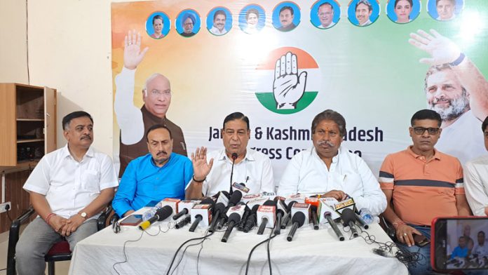 JKPCC chief spokesperson Ravinder Sharma flanked by working president Raman Bhalla addressing a press conference at Jammu on Friday. —Excelsior/Rakesh