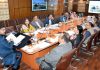 Minister for Science & Technology Satish Sharma chairing a meeting at Civil Secretariat Srinagar.