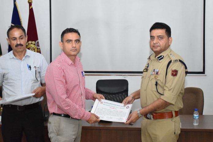 SSP Rajinder Gupta providing certificate to a dignitary at SKPA Udhampur on Thursday.