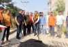 Senior BJP leader KD Singh inaugurating blacktopping of a road in Jammu on Sunday.