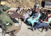 Police officers interacting with people during observance of Thana Diwas at one of the Police posts in kathua district on Friday