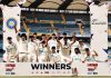 New Zealand cricket team celebrating while posing for a photograph along with trophy on Sunday.