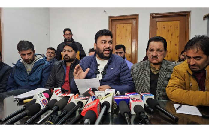President J&K Casual Daily Wagers Forum, Sajad Parray alongwith others addressing a press conference in Srinagar on Monday. -Excelsior/Shakeel President J&K Casual Daily Wagers Forum, Sajad Parray alongwith others addressing a press conference in Srinagar on Monday. -Excelsior/Shakeel