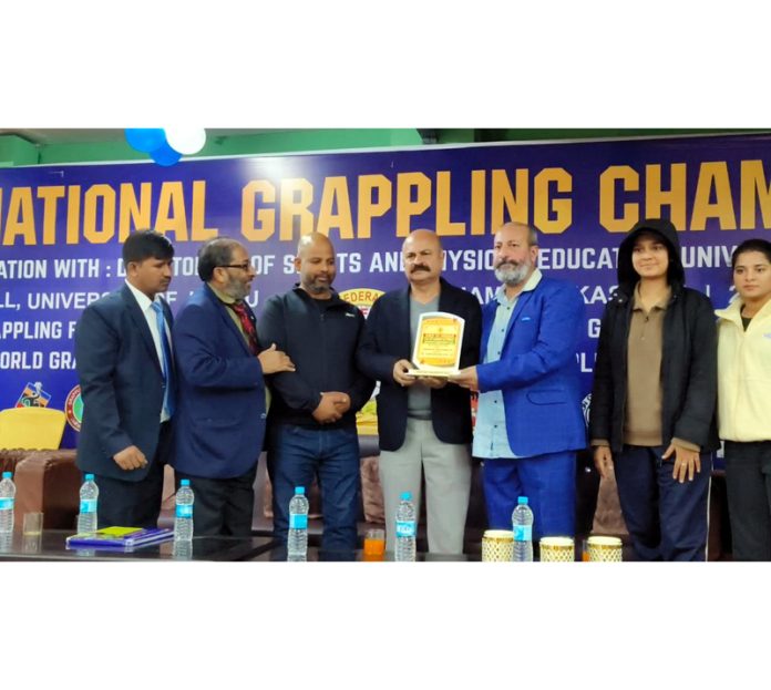 MLA Yudhvir Sethi along with others at the closing ceremony of Junior National Grappling Championship in Jammu on Tuesday. MLA Yudhvir Sethi along with others at the closing ceremony of Junior National Grappling Championship in Jammu on Tuesday.
