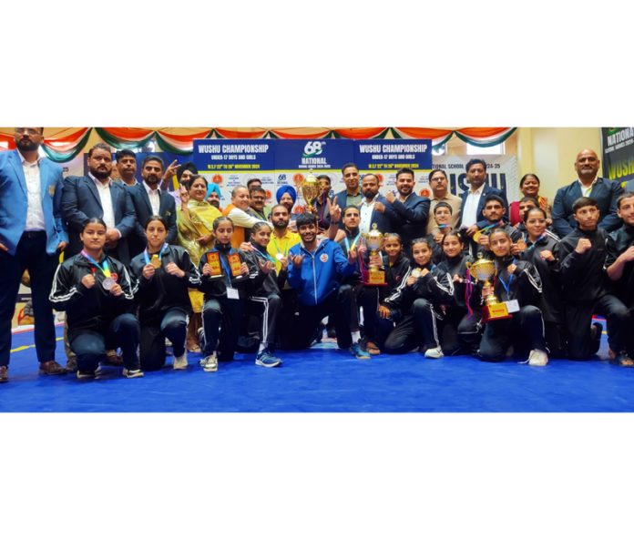 Winners displayiing their trophies and medals on culmination of Wushu Championship in Jammu on Tuesday. Winners displayiing their trophies and medals on culmination of Wushu Championship in Jammu on Tuesday.