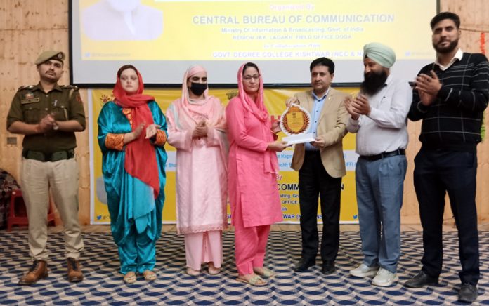 Prof. Bashrat Iqbal, Principal of GDC Kishtwar felicitating the participants of photo exhibition in Kishtwar on Monday. Prof. Bashrat Iqbal, Principal of GDC Kishtwar felicitating the participants of photo exhibition in Kishtwar on Monday.