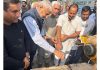 Former Minister and MLA Jammu North, Sham Lal Sharma laying foundation stone of two projects in Ward No 61 on Monday.