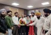 Karan Singh Wazir, Chairman of AJKTWA along with others presenting a bouquet to Divisional Commissioner in Jammu on Monday.