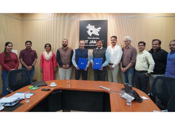 Registrar IIT Jammu and Director STPI Srinagar displaying copies of MoU signed for incubator center. Registrar IIT Jammu and Director STPI Srinagar displaying copies of MoU signed for incubator center.